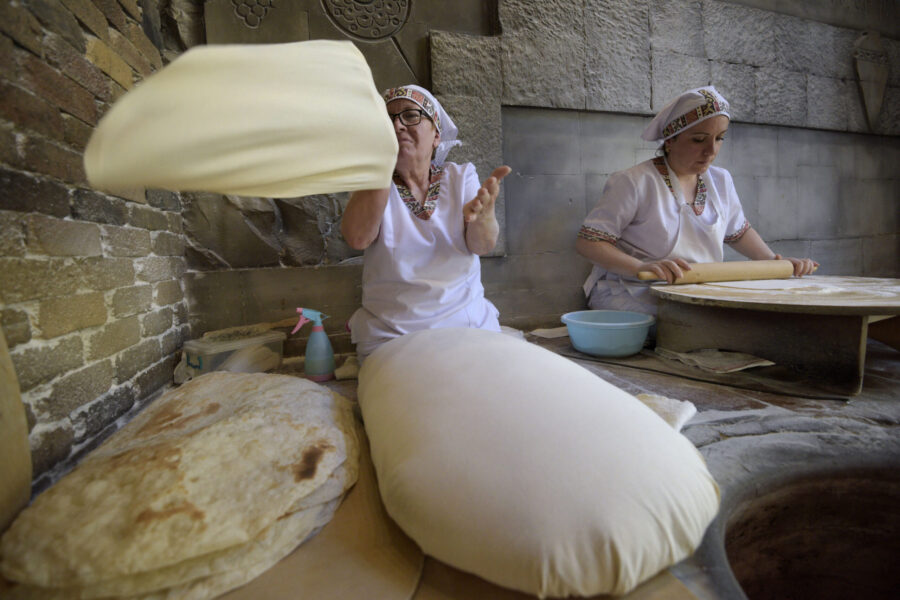 13 May 2019, Yerevan, Armenia - Women bake the famous Armenian bread Lavash at Sherep Restaurant. The lavash is made of wheat flour and baked on the oven's hot wall. Despite a considerable economic growth and improvements in household welfare in the recent years, Armenia remains highly vulnerable to global economic shocks, volatility in international food and commodity prices and weather shocks that negatively affect countries' economy and the food security situation in general. At present, the agricultural sector remains essential for the economy of the country. Agriculture is the main source of economic activity in rural areas and significant contributor to GDP. It produces 14.9 % of GDP (as of 2017) and employs about 36.6 % (2017) of the working population of whom nearly 56% are female farmers. The agricultural sector of Armenia has undergone through the transformation and reforms during the last two decades resulting in a series of policy, institutional, and structural changes. As a result, the ability of the country to maintain food security at the national level does not always translate into better nutrition outcomes at the household level. The Global Hunger Index (GHI) demonstrates that hunger situation in Armenia is about 5 percent.
Since 2016 an FAO Project is targeting the following cbjectives: increase capacity in the countries of the region to establish an enabling environment for the food security of the most vulnerable populations, improve capacities in governments and other relevant stakeholders for human resource development in the food security and nutrition domain. This has been possible by developing  a pilot on School Food and Nutrition Program linked to the Agricultural Sector and a pilot on Strengthening Food Systems for Nutrition Sensitive Social Protection.
