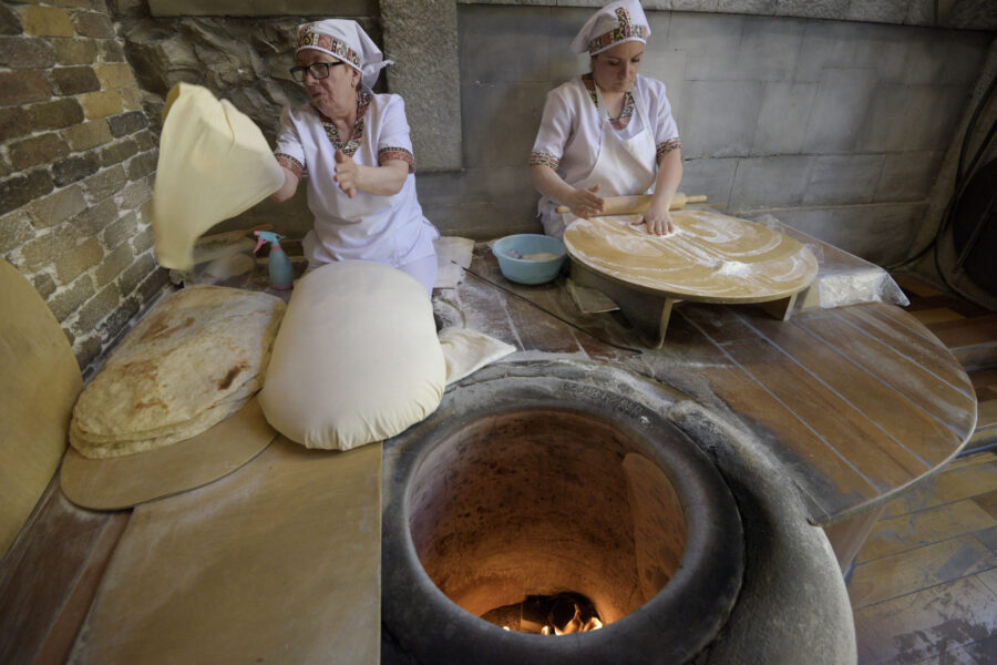 13 May 2019, Yerevan, Armenia - Women bake the famous Armenian bread Lavash at Sherep Restaurant. The lavash is made of wheat flour and baked on the oven's hot wall. Despite a considerable economic growth and improvements in household welfare in the recent years, Armenia remains highly vulnerable to global economic shocks, volatility in international food and commodity prices and weather shocks that negatively affect countries' economy and the food security situation in general. At present, the agricultural sector remains essential for the economy of the country. Agriculture is the main source of economic activity in rural areas and significant contributor to GDP. It produces 14.9 % of GDP (as of 2017) and employs about 36.6 % (2017) of the working population of whom nearly 56% are female farmers. The agricultural sector of Armenia has undergone through the transformation and reforms during the last two decades resulting in a series of policy, institutional, and structural changes. As a result, the ability of the country to maintain food security at the national level does not always translate into better nutrition outcomes at the household level. The Global Hunger Index (GHI) demonstrates that hunger situation in Armenia is about 5 percent.
Since 2016 an FAO Project is targeting the following cbjectives: increase capacity in the countries of the region to establish an enabling environment for the food security of the most vulnerable populations, improve capacities in governments and other relevant stakeholders for human resource development in the food security and nutrition domain. This has been possible by developing  a pilot on School Food and Nutrition Program linked to the Agricultural Sector and a pilot on Strengthening Food Systems for Nutrition Sensitive Social Protection.
